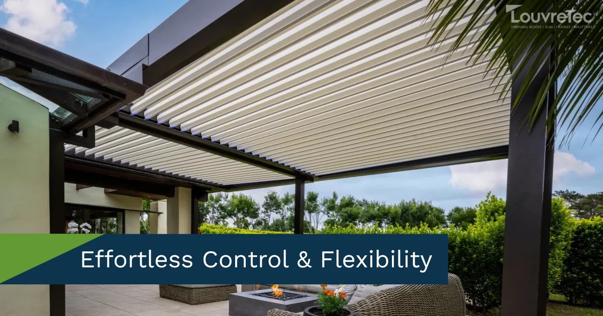 Expansive patio with a white Louvretec opening roof and glass balustrade, perfect for views.