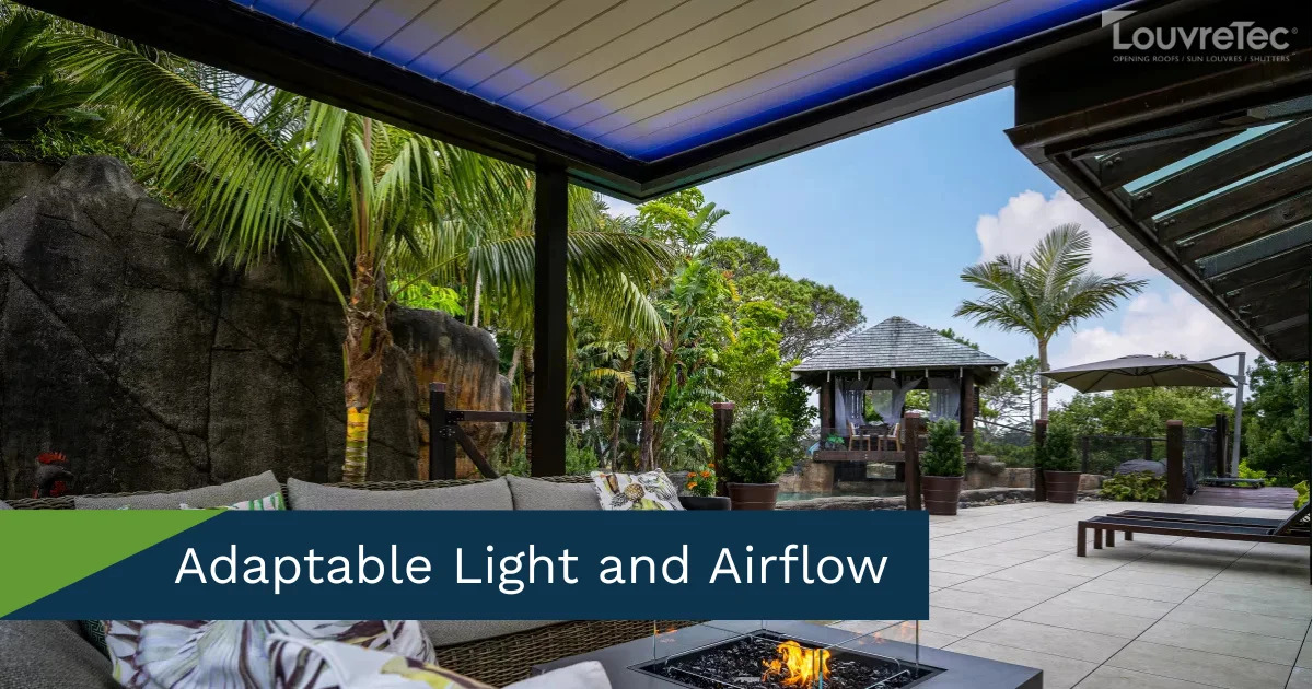  Inviting outdoor lounge area under a Louvretec opening roof, perfect for relaxation.