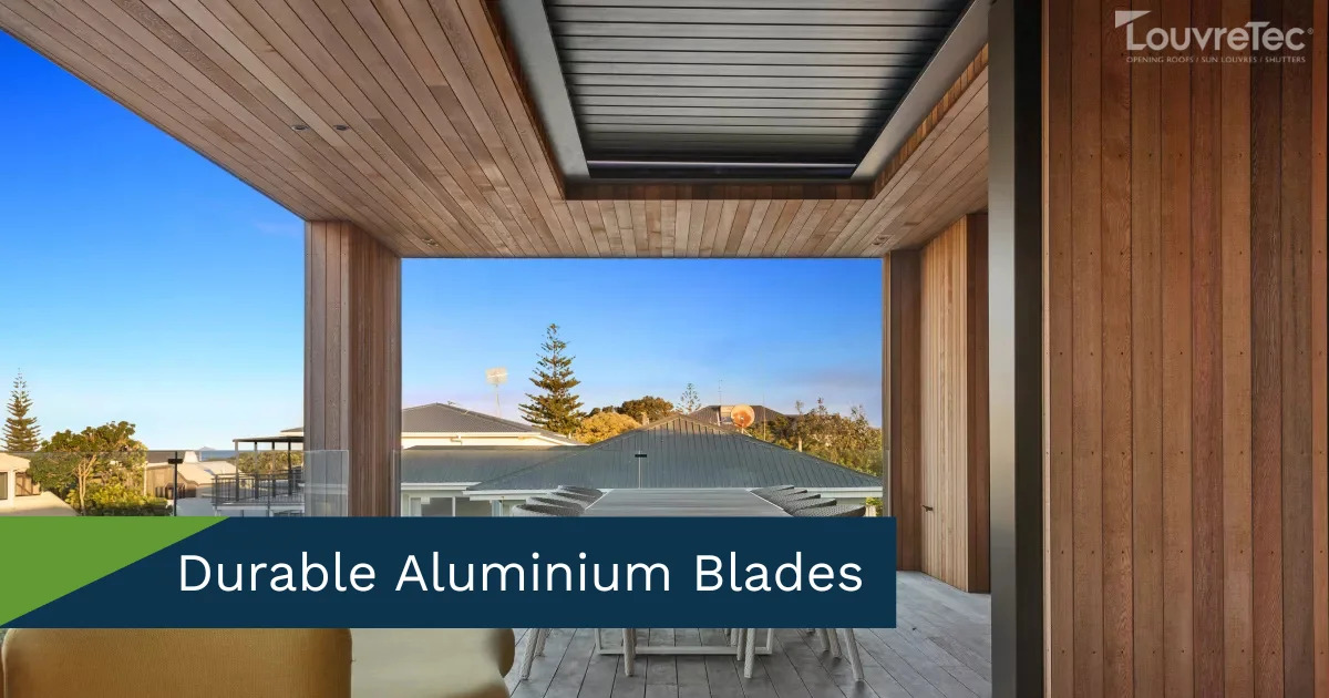Contemporary outdoor space with a Louvretec opening roof and wooden wall paneling.