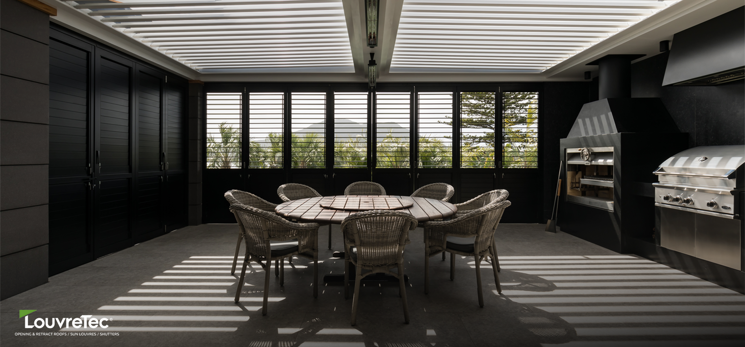 Modern architectural façade featuring Louvretec vertical rectangular sun louvres, designed to provide privacy and solar control while adding structural character.