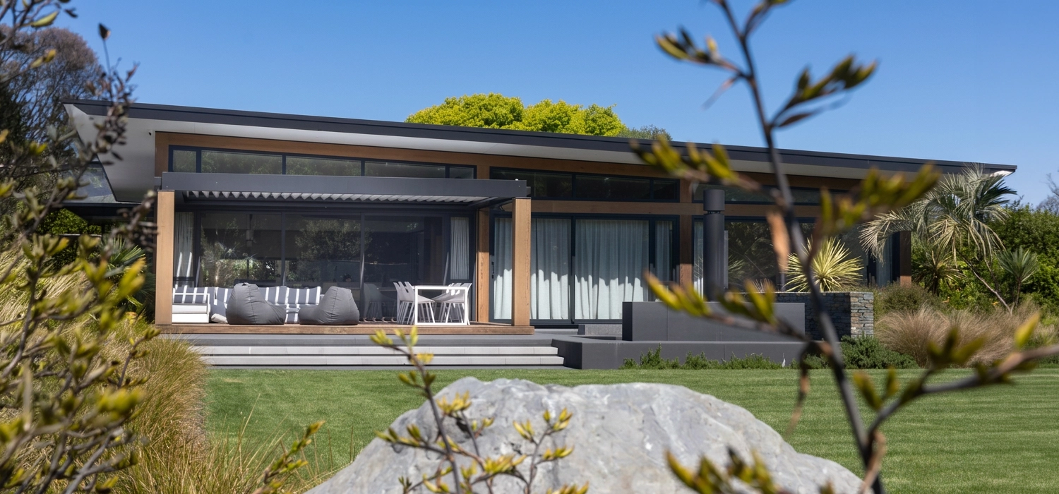 Modern home with an outdoor deck and a Louvretec louvre roof providing stylish shade and weather protection.