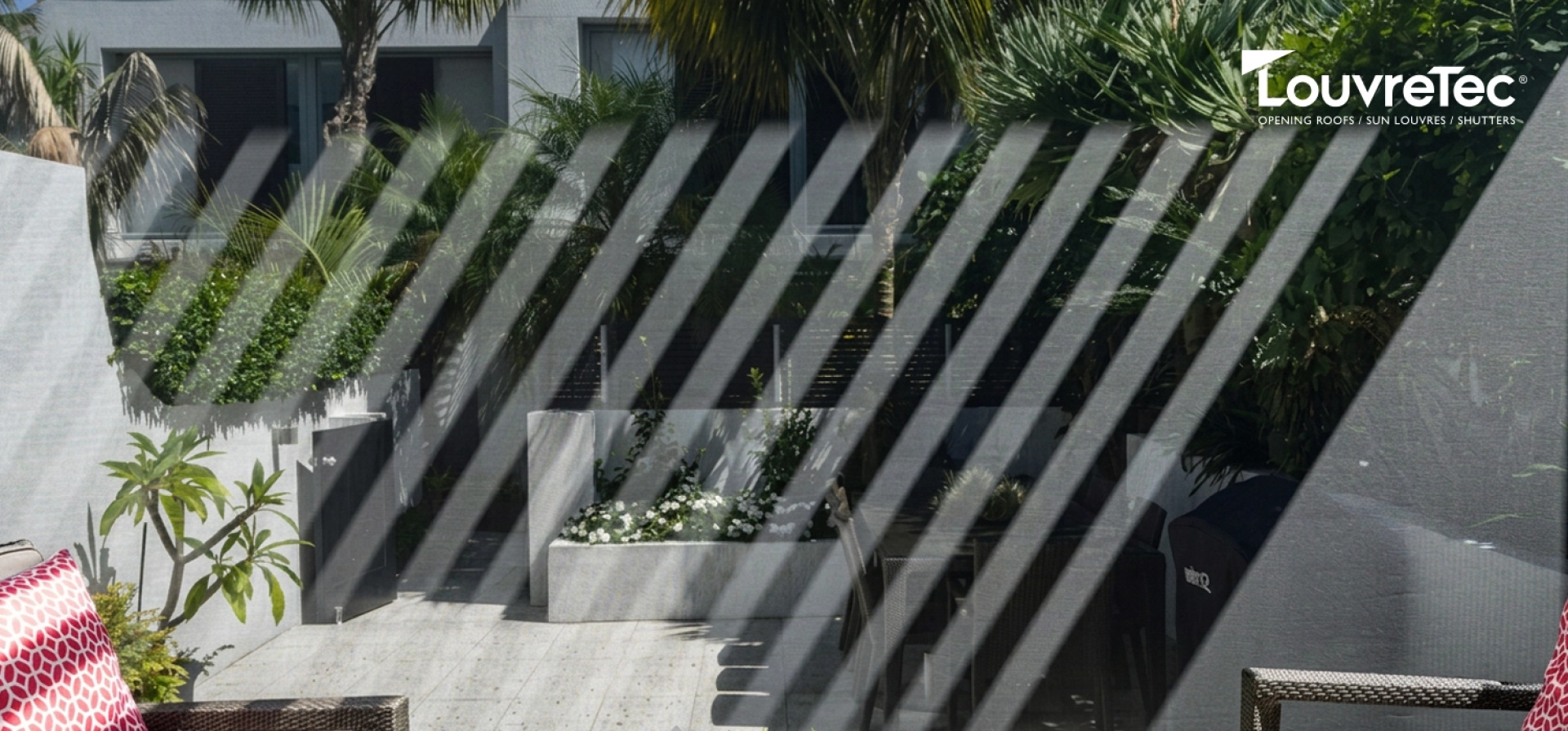 An outdoor patio with chairs and outdoor blinds