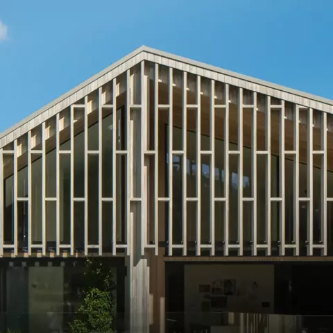 Modern home façade featuring Louvretec vertical rectangular sun louvres, designed to provide privacy and solar control while adding structural character