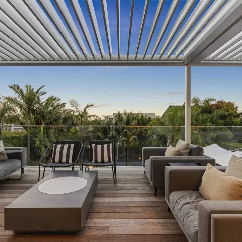 Modern patio with an adjustable louvre roof, providing shade, weather protection, and stylish outdoor living.