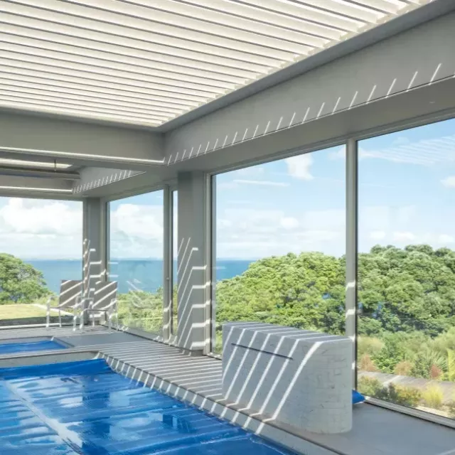 Modern residential building featuring a Louvretec opening roof and clean architectural lines.