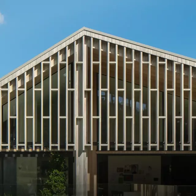 Modern home façade featuring Louvretec vertical rectangular sun louvres, designed to provide privacy and solar control while adding structural character