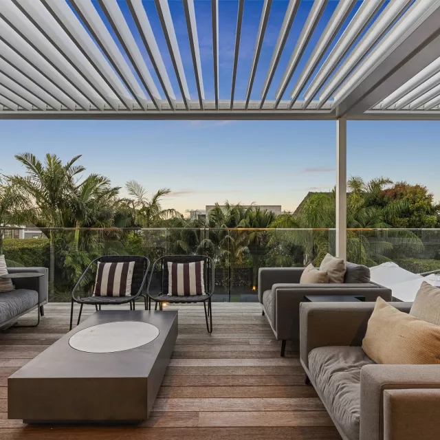 Modern patio with an adjustable louvre roof, providing shade, weather protection, and stylish outdoor living.