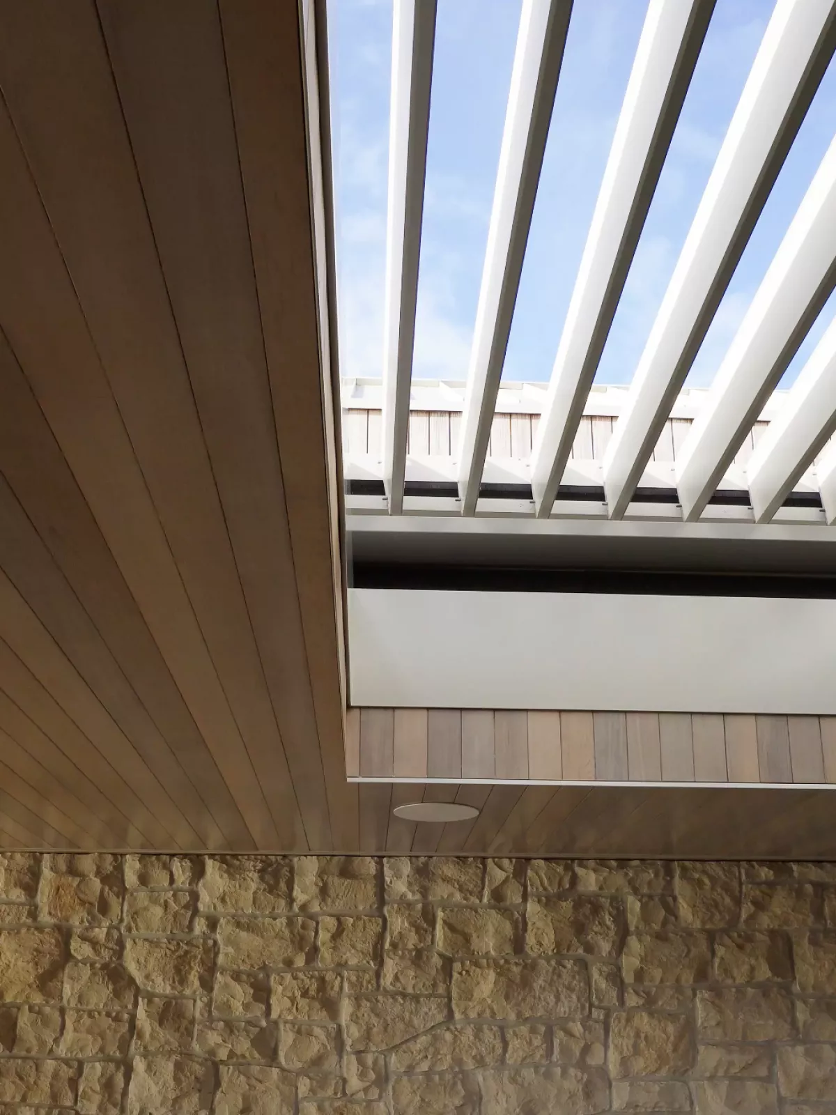 Retract Roof with operable Louvres overhead.